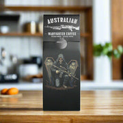Australian Warfighter Coffee packaging with a skeleton holding a rifle and crossbones design.